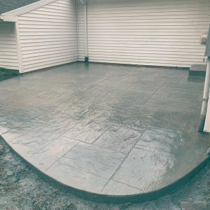 Stamped concrete patio using a random stone stamp pattern