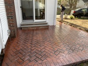Stamped concrete patio using a herringbone stamp pattern