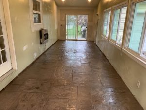 Stamped concrete walkway inside a home
