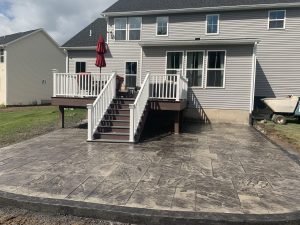 Stamped concrete patio using a random stone stamp pattern