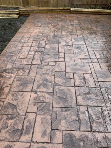 Stamped concrete patio using a random stone stamp pattern