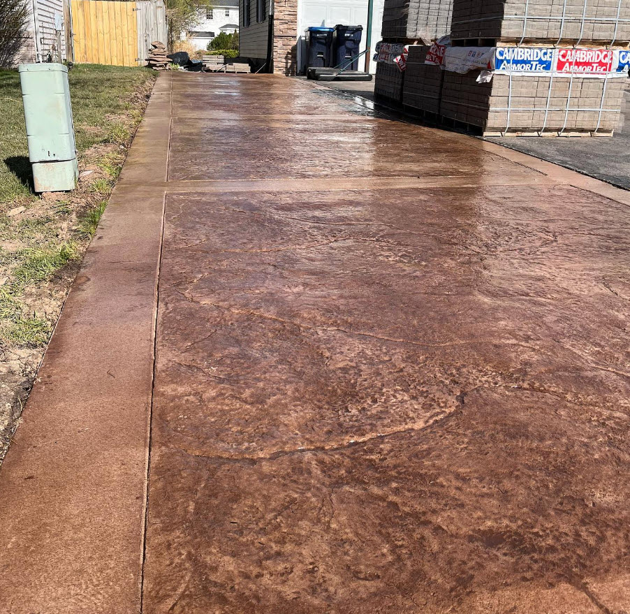 View looking up a stamped concrete driveway